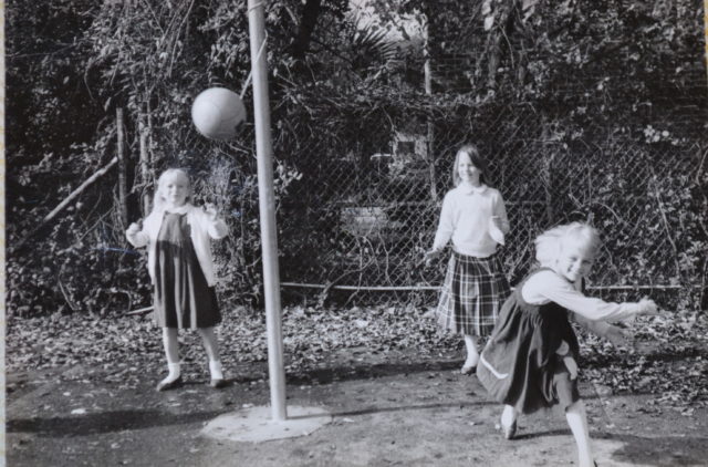 old black and white picture of girls playing tetherball