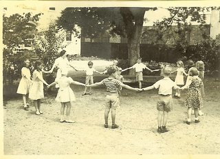old picture students circle holding hands