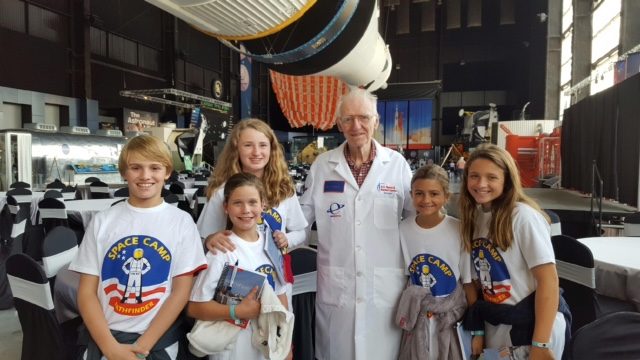space camp students pose with scientist