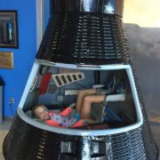 6th grader sits in a space capsule